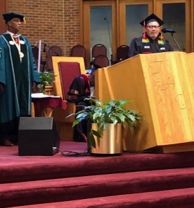 Min Robert Ward reading the New Testament at the ITC GRADUATION 