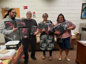 Eugene and Robert Ward, Gail Gay, and Wisteria Ward, enjoying ITC bookstore